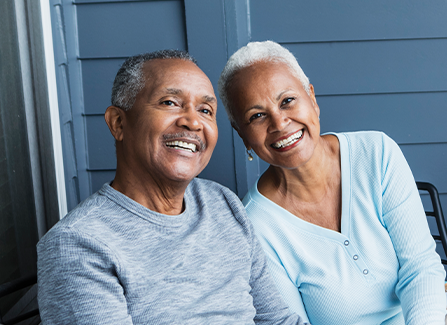 Photo of a man and woman smiling. Link to Life Stage Gift Planner Ages 60-70 Situations.