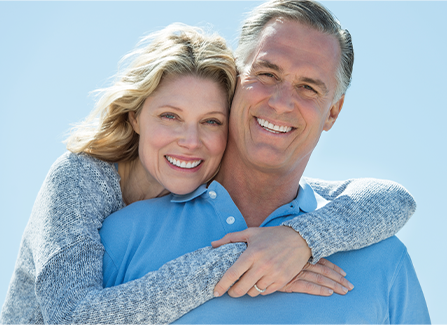 Photo of a couple smiling.