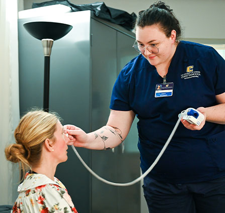 Photo of a nurse taking a temperature. Link to Gifts of Life Insurance.